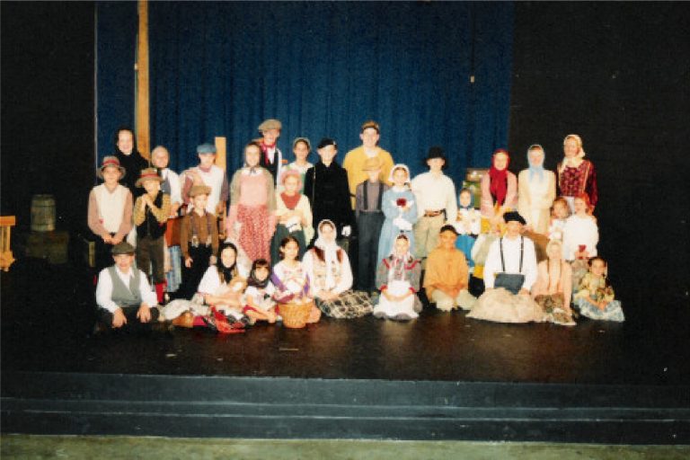 Full cast of I Am Dreaming of America, a play about the journey to Ellis Island in 1908